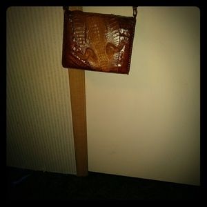 1936 Alligator with baby alligator sitting on moth